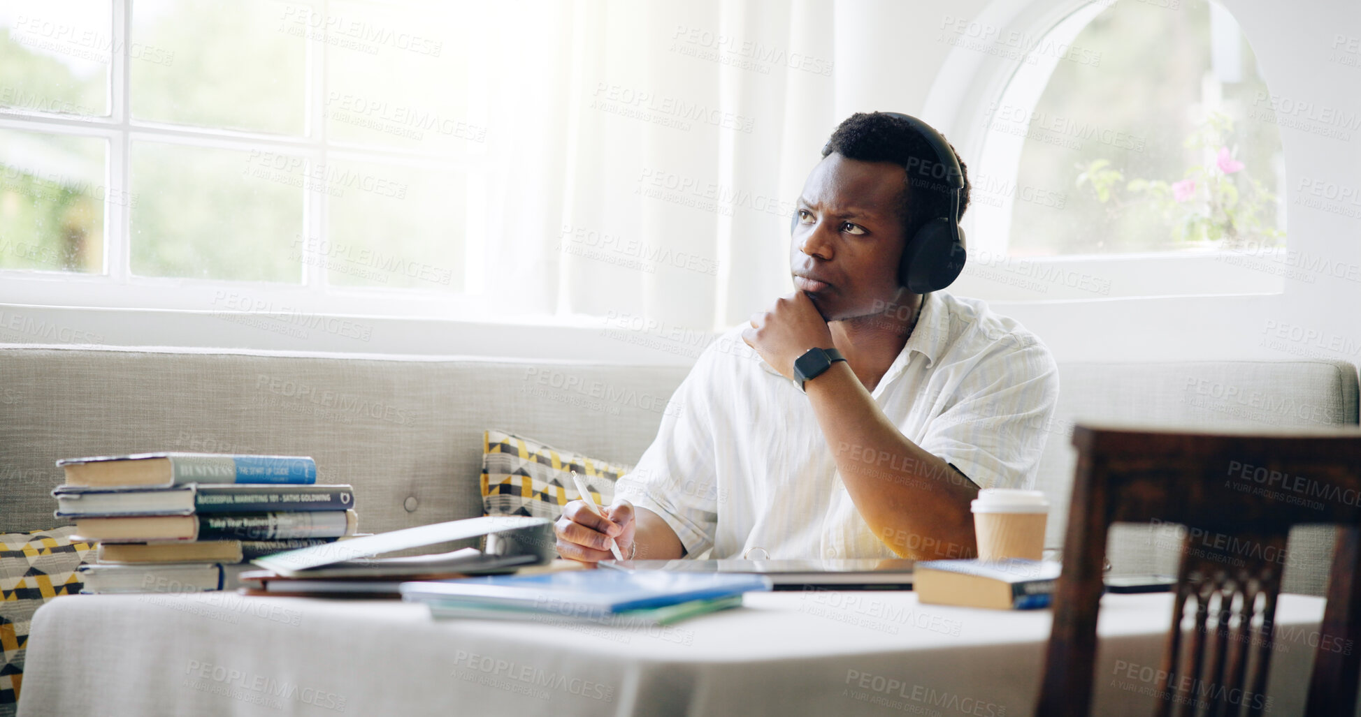 Buy stock photo Black man, student and headphones with thinking in home with books, learning and listening to music with scholarship. Person, notes and streaming for studying, education and solution for college exam