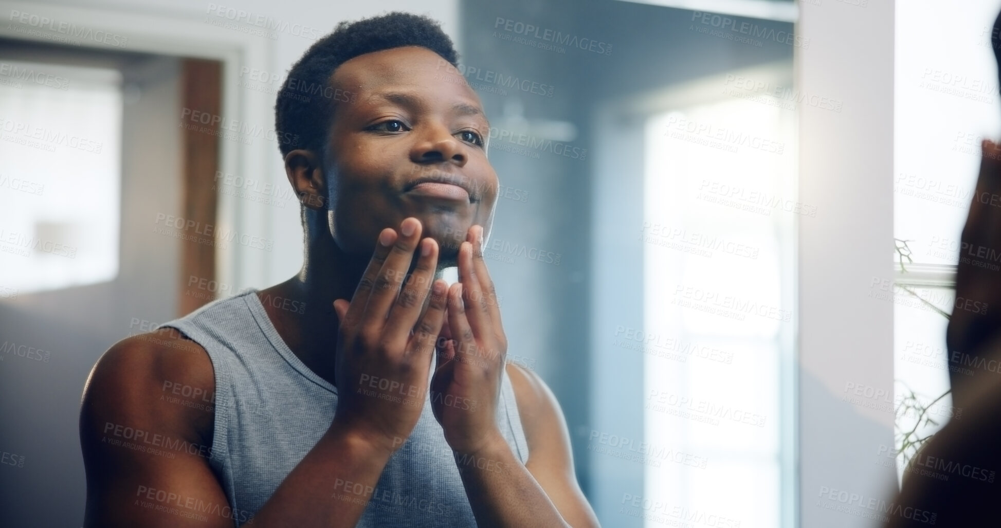 Buy stock photo Black man, face or skincare with mirror for shave, clean grooming or epilation in bathroom at home. African, male person or dermatology with reflection for skin glow, imperfection or hygiene at house