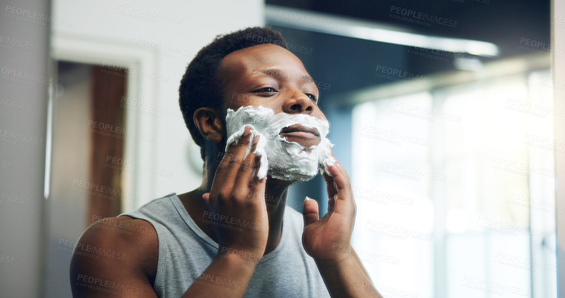 Buy stock photo Black man, shave and mirror with face cream for grooming, epilation or hair removal in bathroom at home. African, male person or facial with aftershave creme for clean beard or skincare routine