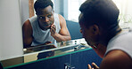 African man, bathroom mirror and inspection for skin with results, reflection and shaving with grooming in home. Person, glow and facial change in morning with thinking, hygiene or cosmetics at house