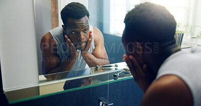 Buy stock photo African man, mirror and inspection for skin with results, reflection or shaving with grooming in home. Person, glow and facial change in morning with thinking, hygiene or health in bathroom at house