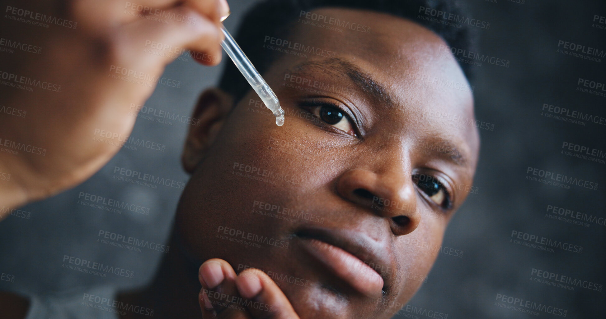 Buy stock photo Serum, beauty and face of black man with dropper for skincare, spa treatment and vitamin c. Dermatology, collagen oil and cosmetics with person on dark background for glow, self care and pov