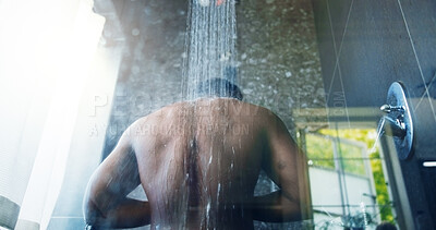 Buy stock photo Man, back and shower in bathroom for hygiene, routine and washing body in low angle at apartment. Person, water and cleaning skin for bacteria, dermatology and grooming process for wellness in home