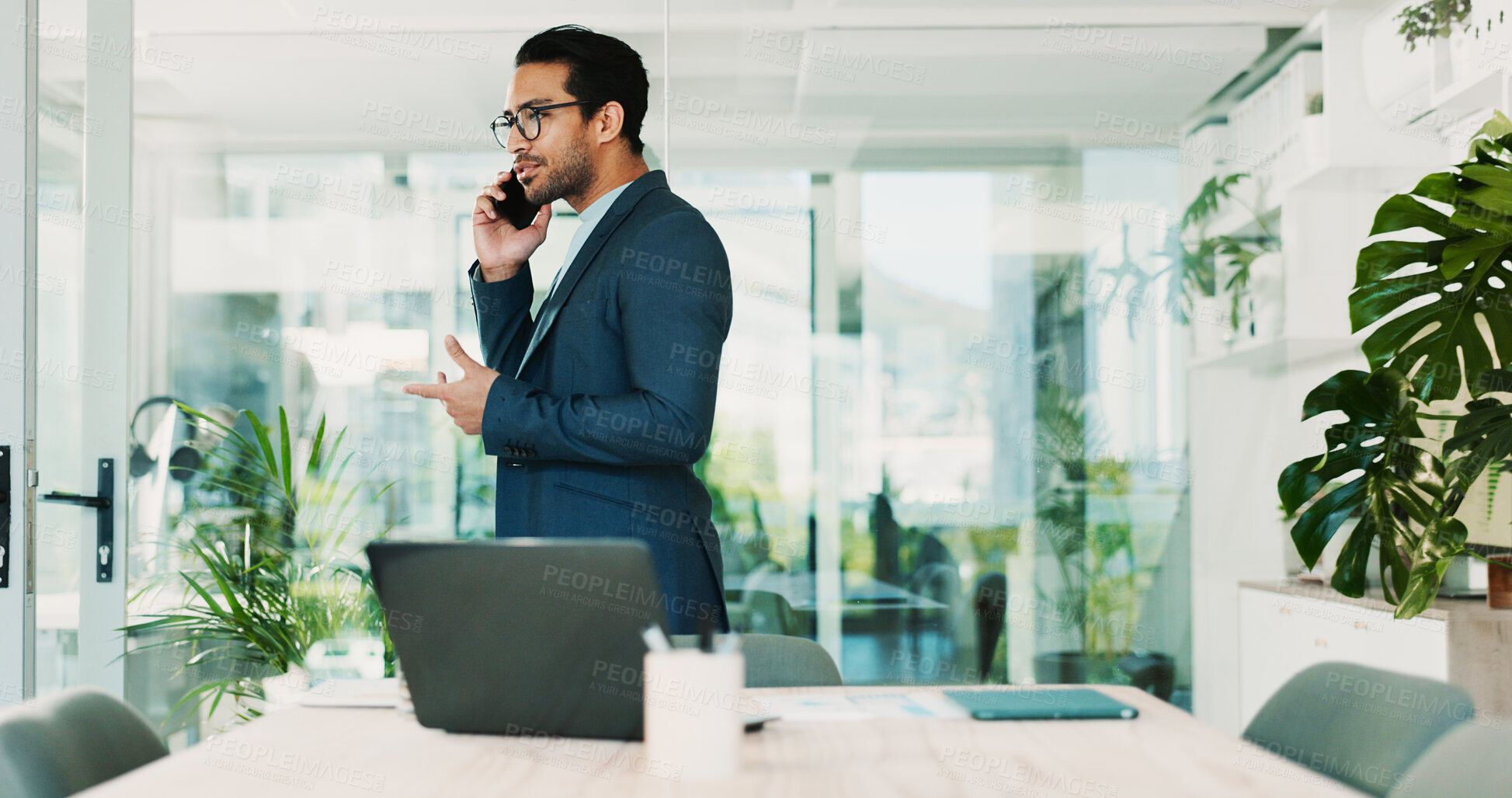 Buy stock photo Man, phone call and talk in office for business, planning and consultation for financial advice at laptop. Broker, tech and contact in agency for budget review, investment pitch and problem solving