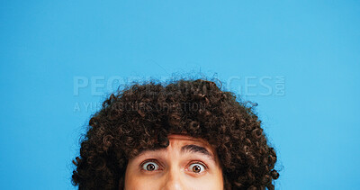 Buy stock photo Man, portrait and hair with shock or surprise on studio for news, announcement or alert on a blue background. Male person, model or OMG expression with afro or hairstyle for gossip on mockup space