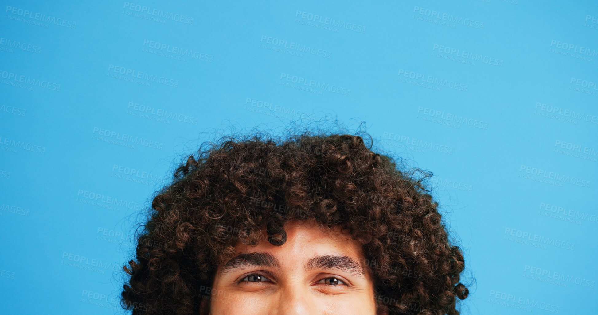 Buy stock photo Man, head and portrait with space in studio for curly hair, style or volume isolated on a blue background. Male person, hairstyle or young model with mockup, eyes or awareness for afro, mind or sight