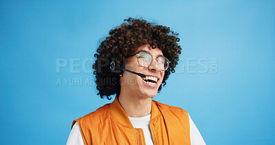 Buy stock photo Studio, man and laughing with headset for call center, communication and customer service for sales. Space, male person and agent with mic for client support, happy and business by blue background