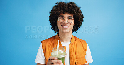 Buy stock photo Studio, man and portrait with smoothie for drink, digestive health and fruit juice in recycled plastic. Mockup space, nutritionist and smile with green shake for diet, nutrition and blue background