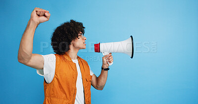 Buy stock photo Man, profile and activist with bullhorn in studio for protest, strike or announcement on a blue background. Male person, rebel or march with loudspeaker for awareness, alert or message on space