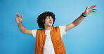 Dance, headphones and fashion with man in studio for celebration, streaming and gen z with cool style. Happiness, energy and afro hair with person on blue background for hip hop music, audio and fun