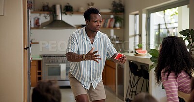 Buy stock photo Man, clue game and playing with friends for challenge, fun and bonding together in home. Person acting, excited pantomime and party for weekend, social gathering or activity in living room at house