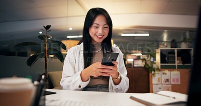 Buy stock photo Night, happy woman and phone in office for business, creativity or social media on break. Designer, smile or mobile connection in digital agency for networking, positive feedback or rest for deadline