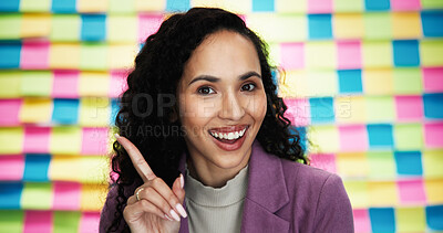 Buy stock photo Happy woman, portrait and finger in office for answer, advice and project planning with creativity. Designer, smile or gesture at sticky notes with vote, feedback or proposal for career development