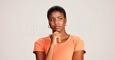 Buy stock photo Black woman, confused or thinking in studio for fashion, decision or education offer at mockup space. Design student, idea or stress on white background for casual style, scholarship choice or doubt