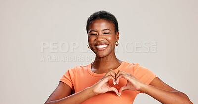 Buy stock photo Heart hands, smile and love with portrait of black woman in studio for support, peace and pride. Solidarity, health and happiness with person from Kenya on white background for emoji icon and care