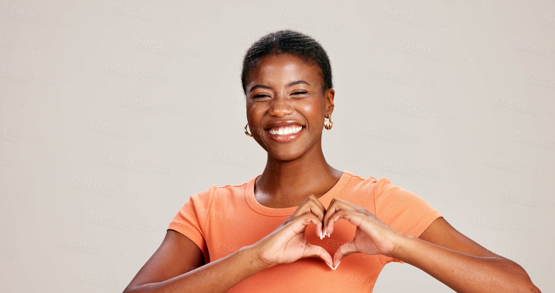 Buy stock photo Heart hands, smile and love with portrait of black woman in studio for support, peace and pride. Solidarity, health and happiness with person from Kenya on white background for emoji icon and care