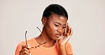 Glasses, headache and eye strain with black woman in studio for stress, vision fatigue and pain. Vertigo, anxiety and frustrated with person on white background for tension, pressure and migraine