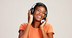 Music, woman and laughing with headphones on studio background for funny podcast, radio app and enjoyment. Audio playlist, black person and excited with album, streaming subscription and mockup space