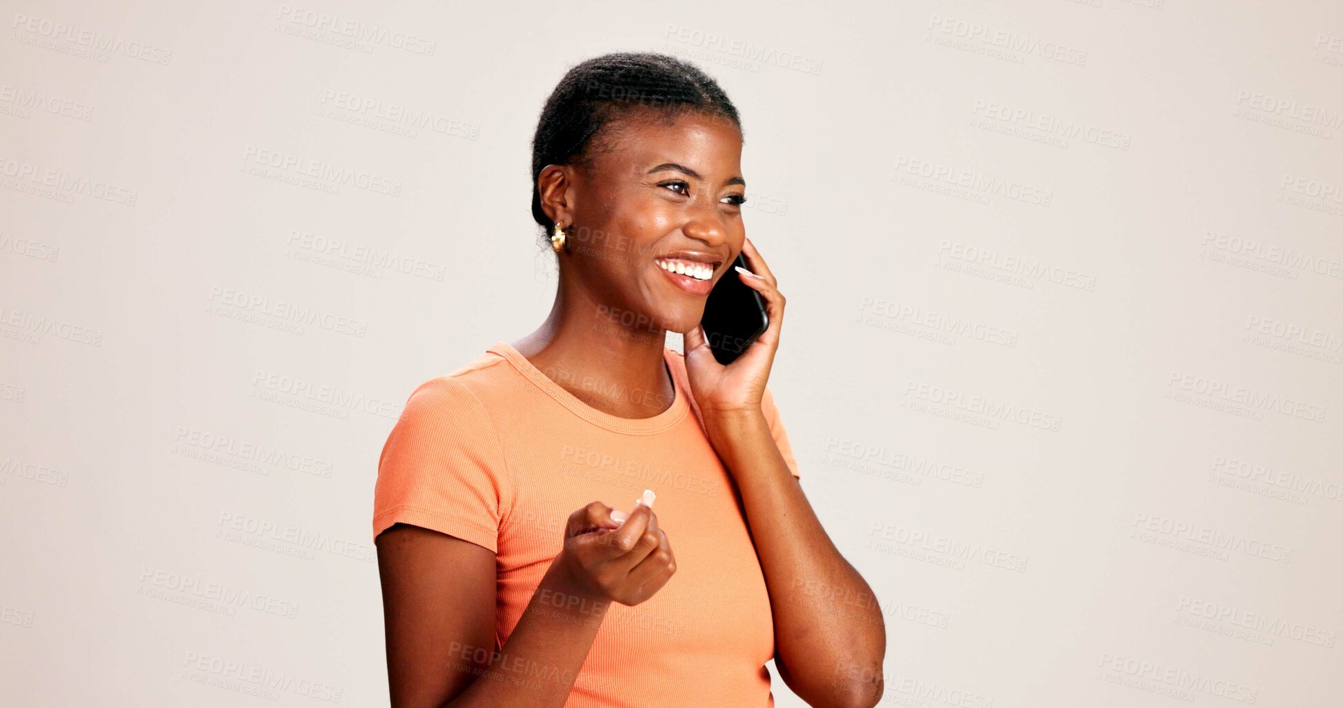 Buy stock photo Happy, black woman or talking with phone call in studio for communication or discussion on a white background. African female person or model with smile on mobile smartphone for conversation or chat