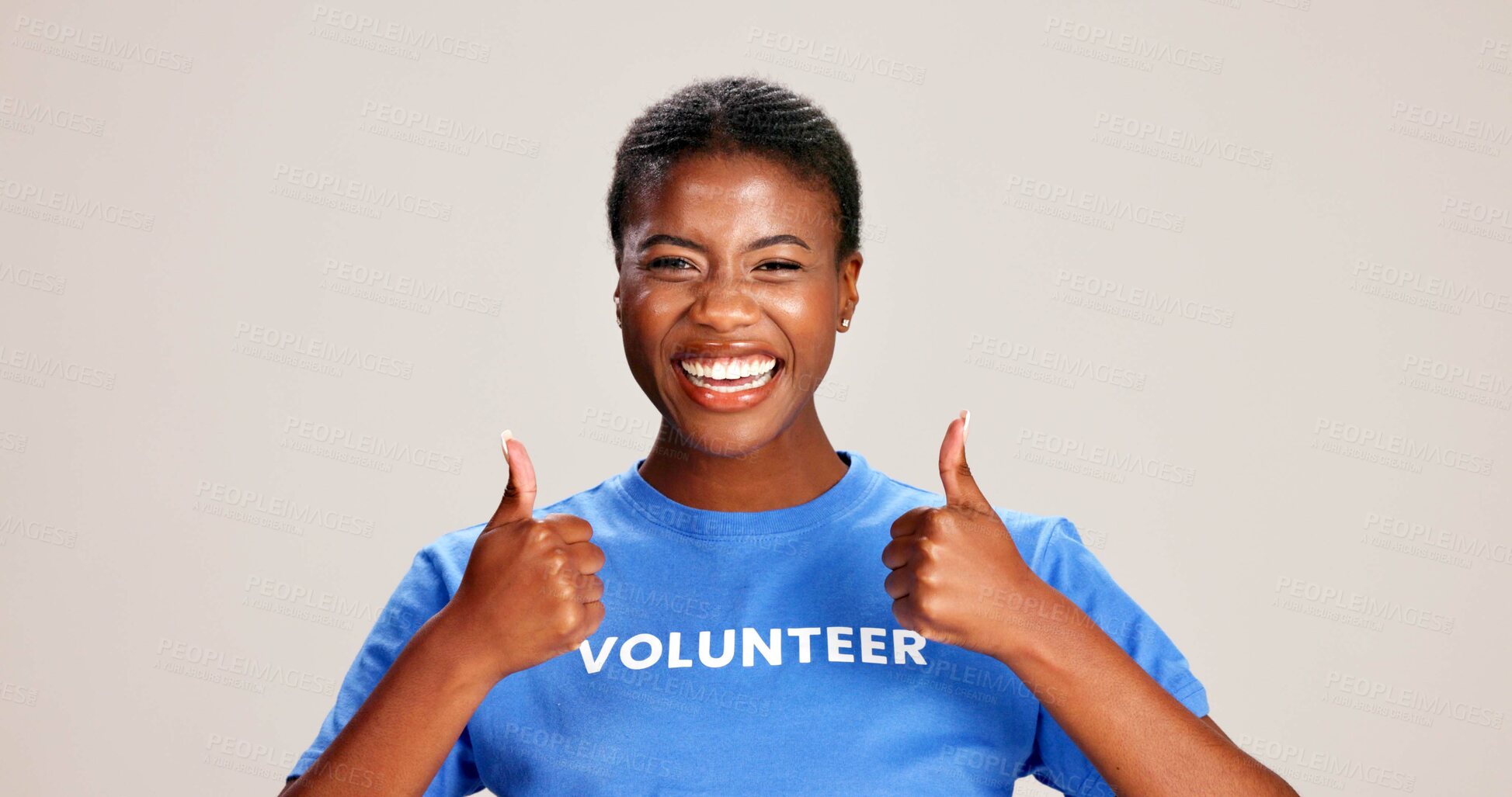 Buy stock photo Happy, black woman and volunteer with thumbs up for charity or community service on a white studio background. Portrait, African or female person with smile, like emoji or yes sign for NGO outreach