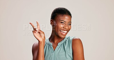 Buy stock photo Black woman, happy or peace sign in studio with fashion, positive attitude or good mood. Gen z girl, portrait or hand V on white background with relax, emoji gesture or support vote with casual style