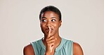 Secret, quiet and woman with finger on lips for surprise announcement, confidential information and privacy. Mockup, black person and hush gesture on studio background for gossip, whisper or thinking