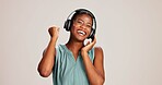 Dancing, woman or happy with headphones on studio background for radio app, enjoyment or movement. Audio playlist, black person or excited with music, online sound or streaming subscription on mockup