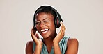 Music, girl and laughing with headphones on studio background for podcast joke, funny radio app or enjoyment. Audio album, black woman and happy with mockup, sound playlist or streaming subscription