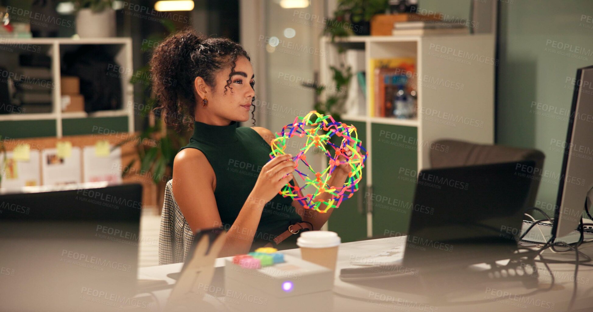 Buy stock photo Business woman, laptop and thinking with fidget toy, creative agency and ideas for night brainstorming. Girl, brand consultant and multi screen computer with project, proposal and expandable ball