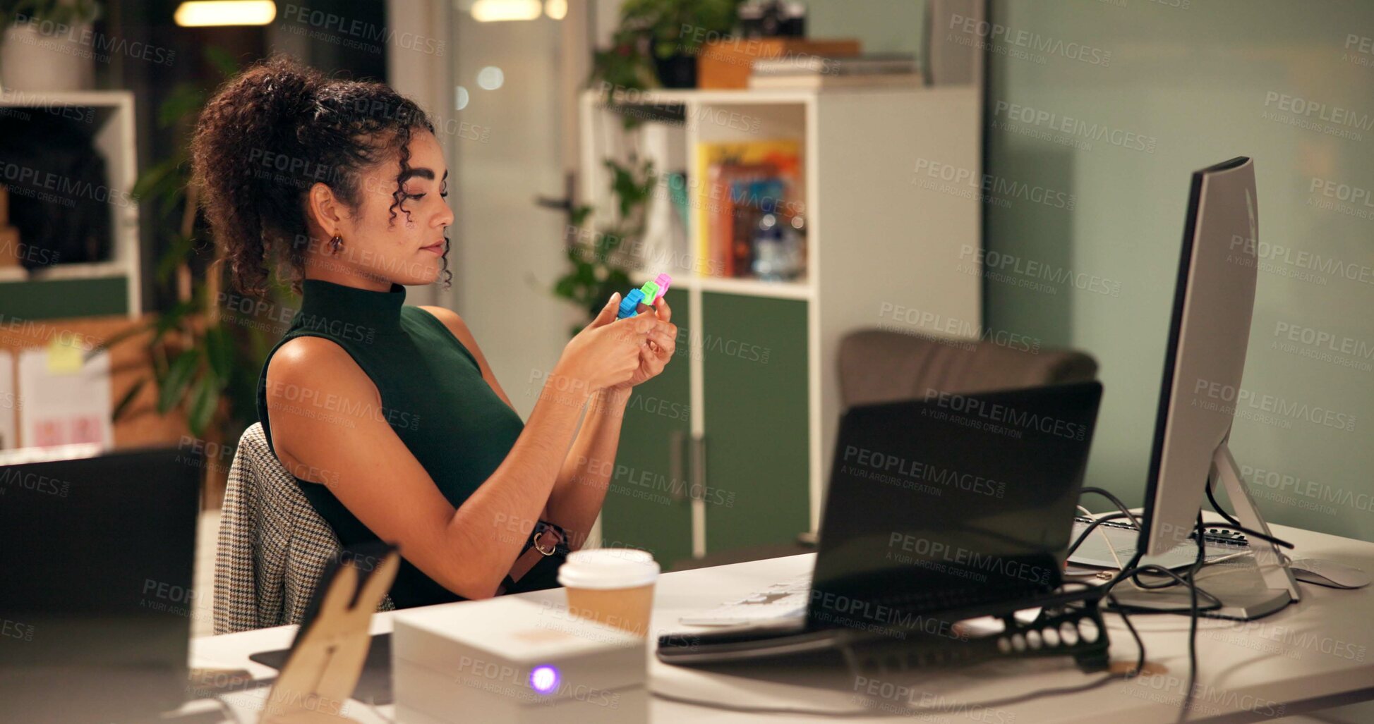 Buy stock photo Business woman, laptop and brainstorming with popit toy, creative agency and ideas for night thinking. Girl, brand consultant or multi screen computer with project, proposal or office fidget stimming