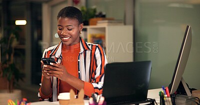 Buy stock photo Night, black woman and smile in office with phone, contact and creative feedback. Designer, happy and mobile in agency with good news, deadline extension and positive review on company social media
