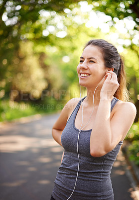 Buy stock photo Fitness, outdoor and woman with earphones, smile and motivation with exercise. Person, runner and athlete in park, listening to music and wellness with nature, song and healthy with audio and sound