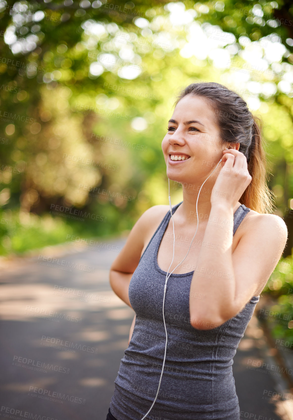 Buy stock photo Fitness, outdoor and woman with earphones, smile and motivation with exercise. Person, runner and athlete in park, listening to music and wellness with nature, song and healthy with audio and sound
