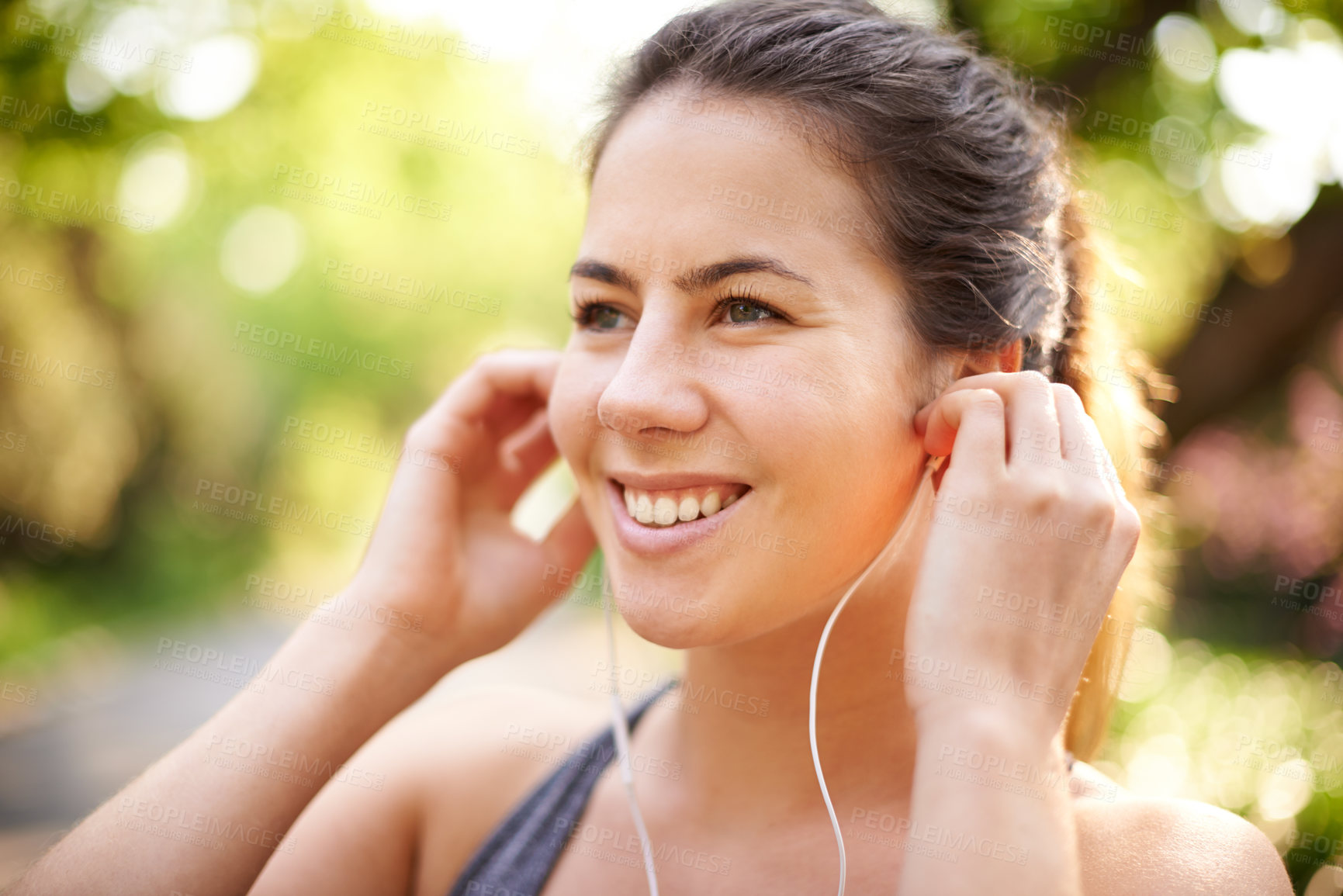 Buy stock photo Runner, happy and woman with music at park for cardio break, running podcast and relax with track. Athlete, person and earphones in nature for exercise, listening to radio and thinking of workout