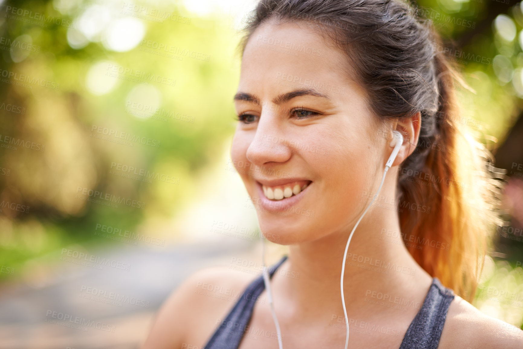 Buy stock photo Runner, smile and woman with music at park for cardio break, running podcast or fitness sound. Space, female athlete and earphones in nature for exercise, listening to radio or thinking of workout