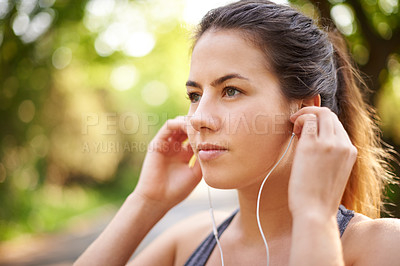 Buy stock photo Nature, serious and woman with earphones, fitness and streaming of music for motivation and runner. Outdoor, training and person with sportswear for exercise, listening and practice for marathon