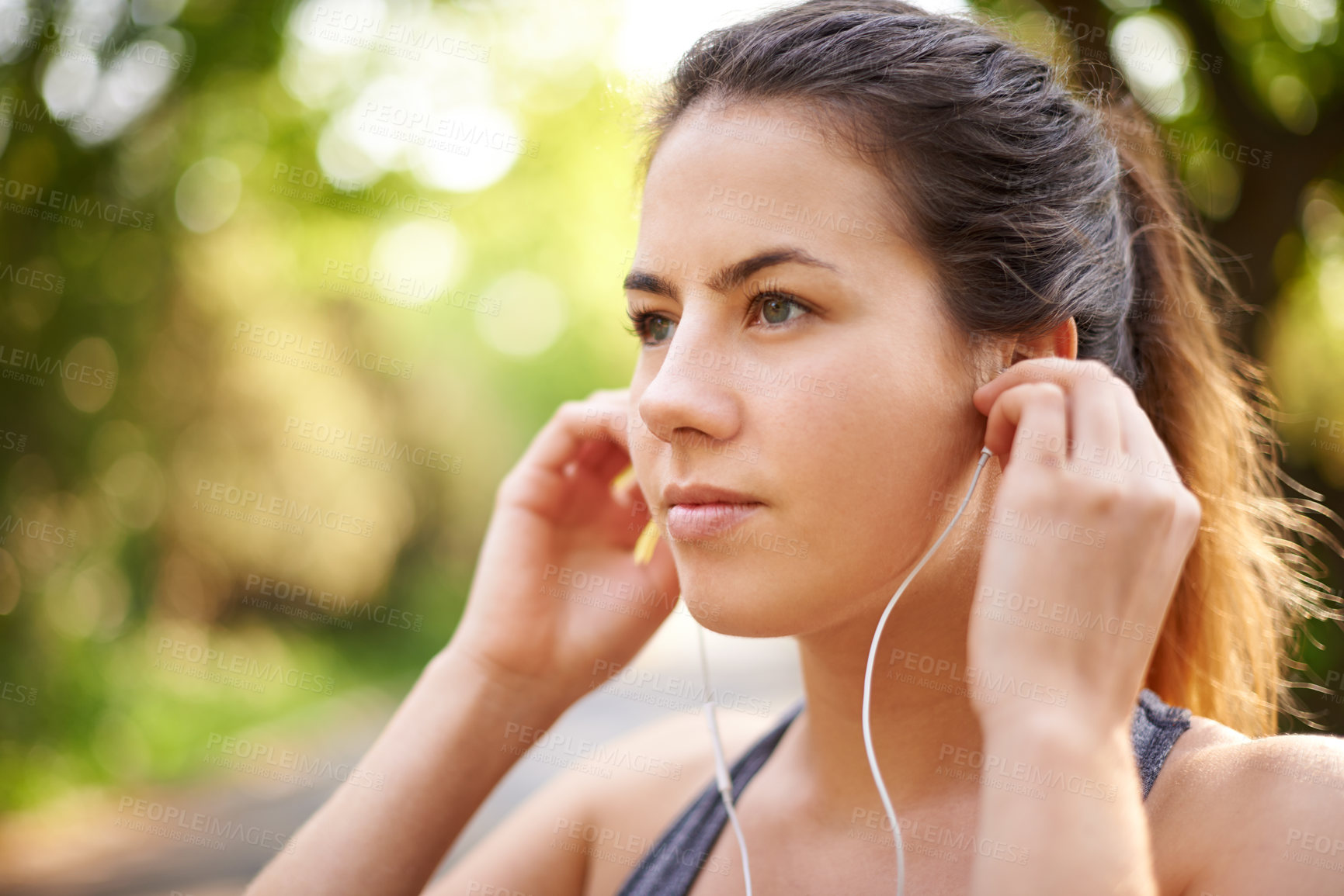 Buy stock photo Nature, serious and woman with earphones, fitness and streaming of music for motivation and runner. Outdoor, training and person with sportswear for exercise, listening and practice for marathon