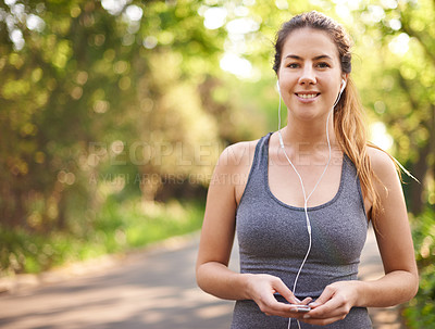Buy stock photo Woman, earphones and outdoor for exercise in park, sports music and runner in countryside. Cardio, athlete and female person for fitness in portrait, workout podcast and nature for marathon training