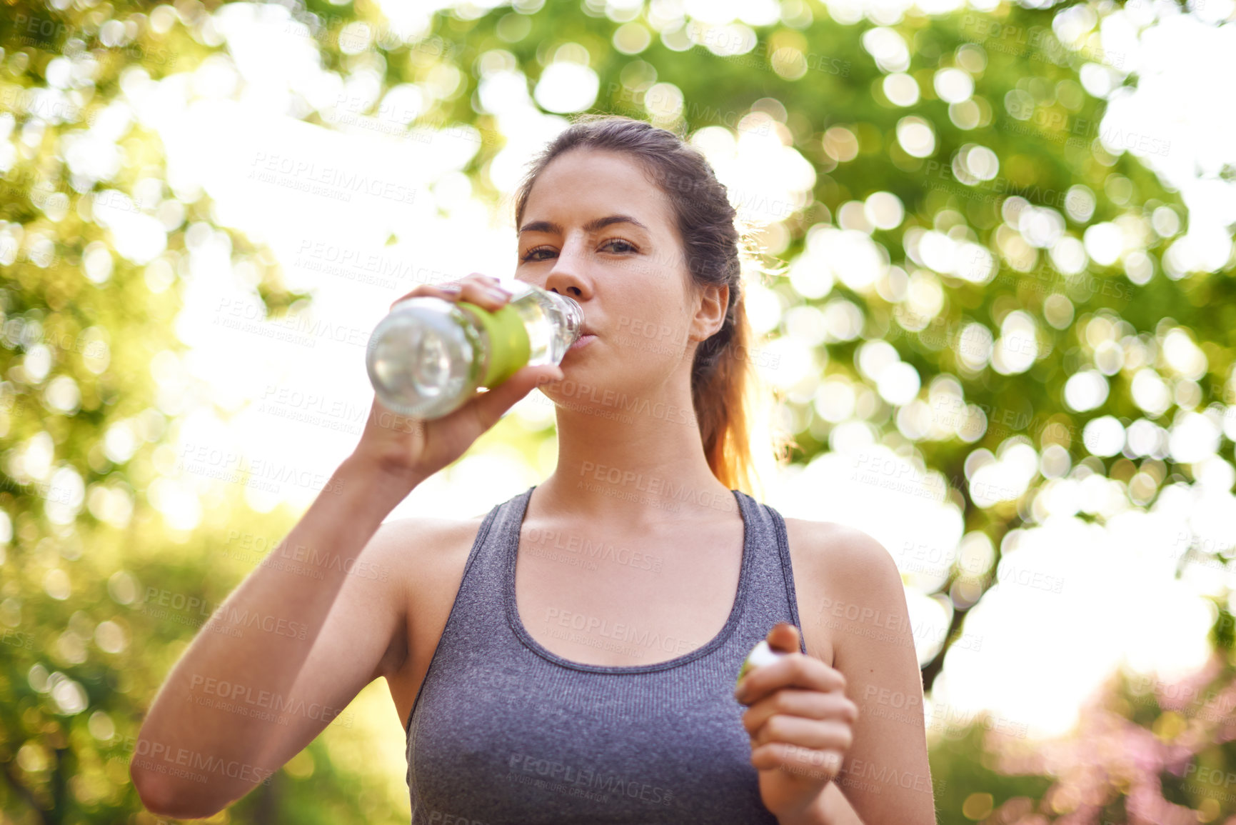 Buy stock photo Fitness, portrait and woman drinking water at park for natural nutrition, running break and refresh from exercise. Runner, resting and mineral beverage outdoor for hydration, thirst and healthy body