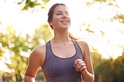 Buy stock photo Running, fitness and woman with smile, energy and nature with challenge, wellness and endurance. Healthy person, outdoor or athlete with training, cardio or workout with sports or runner in street