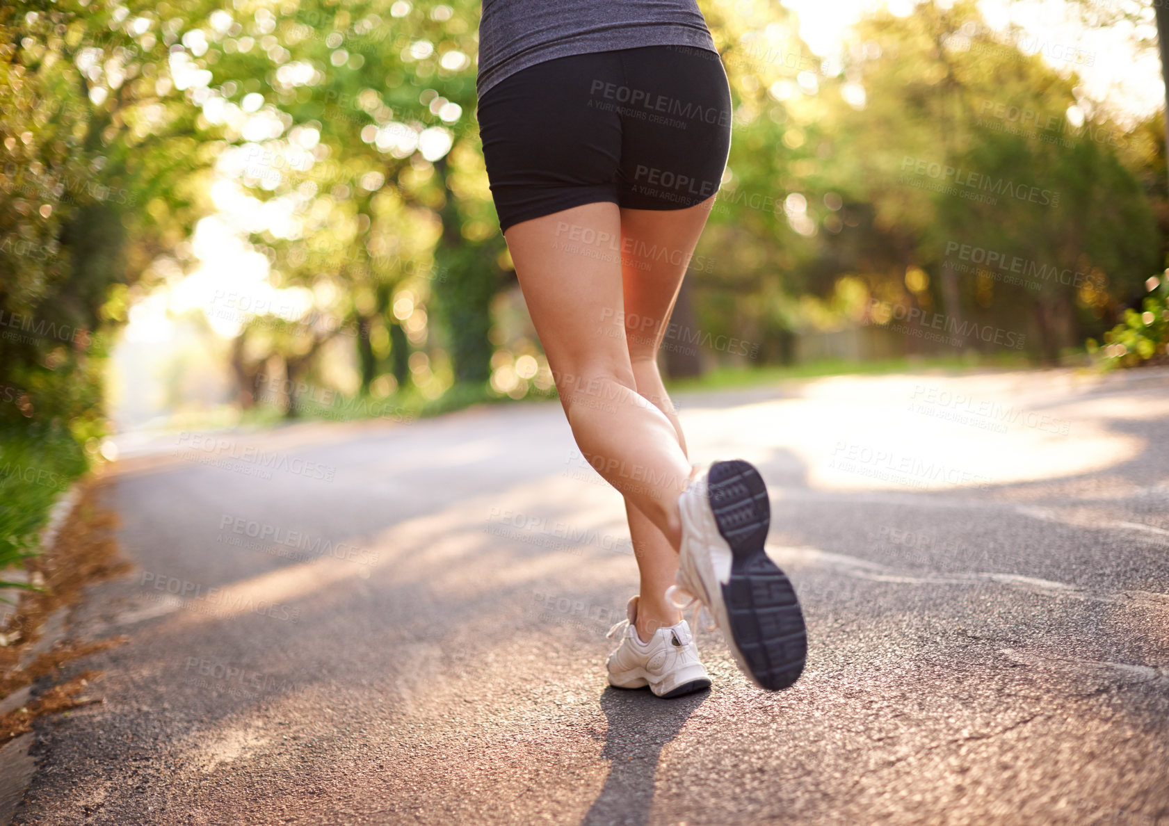 Buy stock photo Legs, fitness and person running on road for cardio exercise, marathon performance and cardiovascular health. Back, sneakers and runner jog outdoor for wellness challenge and competition endurance