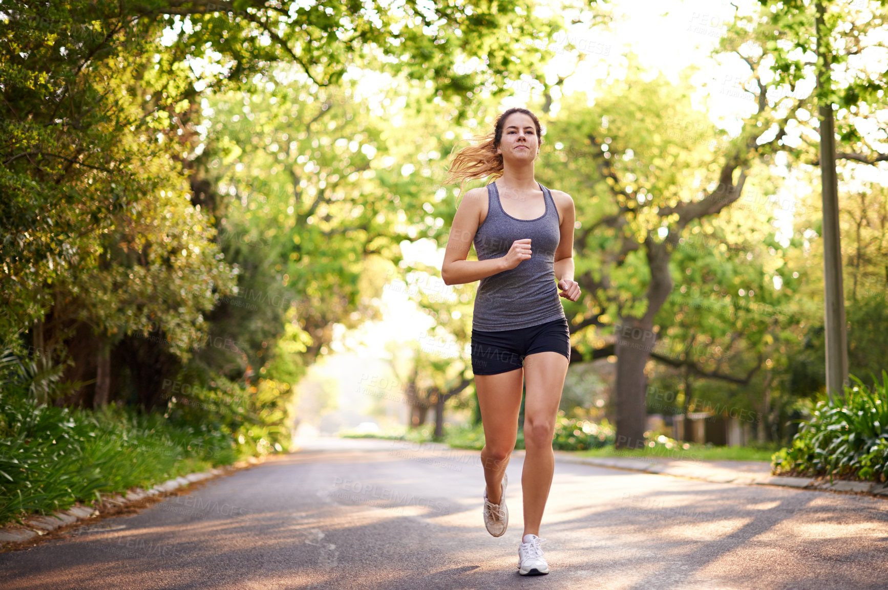 Buy stock photo Running, fitness and woman with training, wellness and nature with challenge, cardio and endurance. Healthy person, outdoor or athlete with practice, energy or workout with sports or runner in street