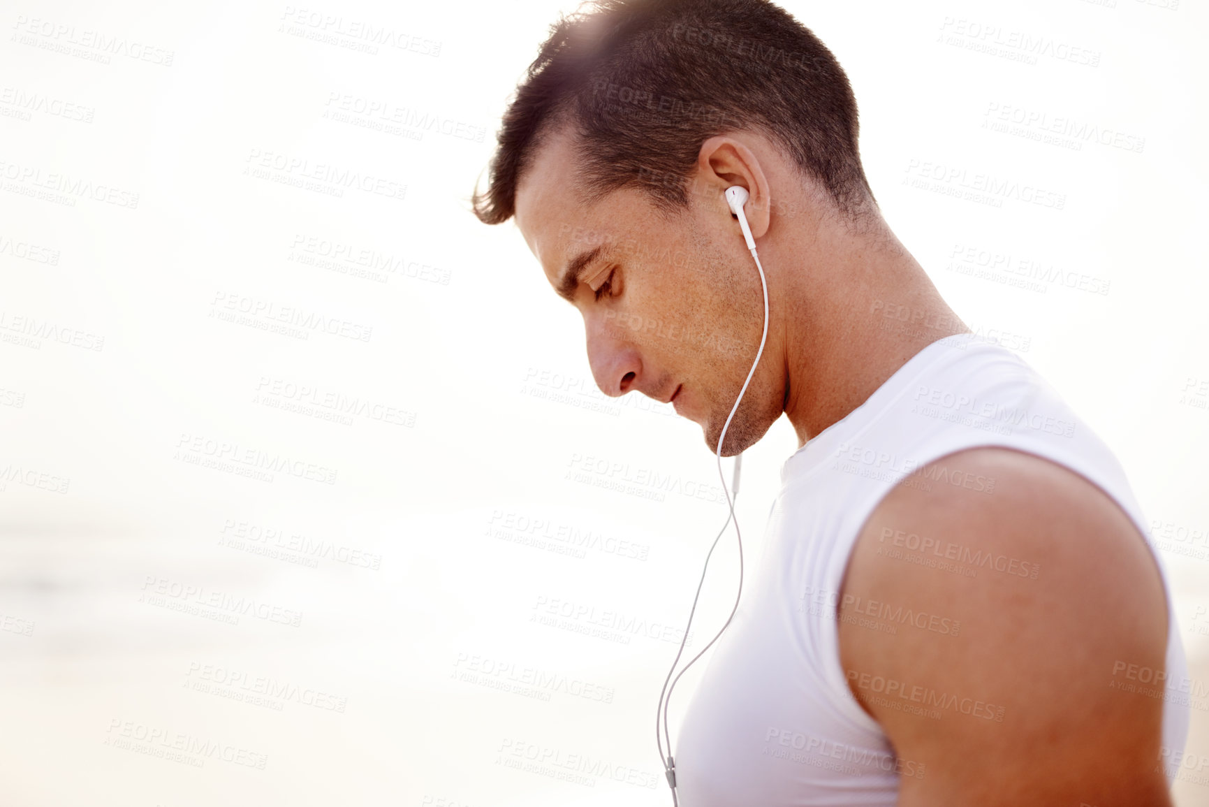 Buy stock photo Earphones, fitness and man outdoor for running listening to music, podcast or radio for wellness. Health, sports and male athlete with audio tech for cardio workout, exercise or training playlist.