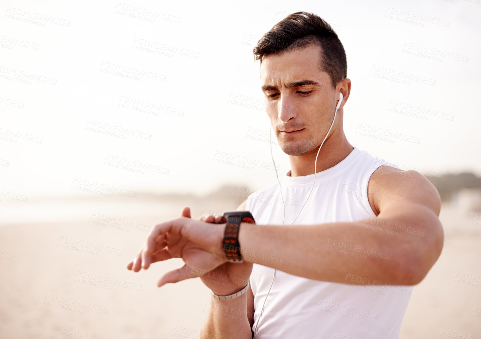 Buy stock photo Smart watch, earphones and man outdoor for fitness with running tracker app for heart rate. Sports, audio tech and male athlete with digital wristband for cardio activity monitoring with marathon.