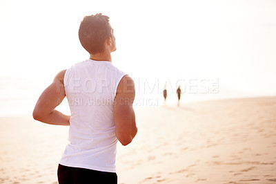 Buy stock photo Fitness, sunset and man running at beach for wellness, body health and sports workout with back view. Ocean, athlete and runner jog for cardio training, lose weight and energy for endurance exercise