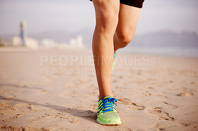 Buy stock photo Person, sand and legs running in outdoor for fitness, cardio challenge and sports workout for exercise. Jog, footwear and athlete for training on beach, sneakers and performance on tropical holiday