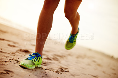 Buy stock photo Person, sand and feet running on beach for fitness, outdoor cardio and sports workout for exercise. Island, sneakers and athlete for training in nature, ocean and performance on tropical holiday