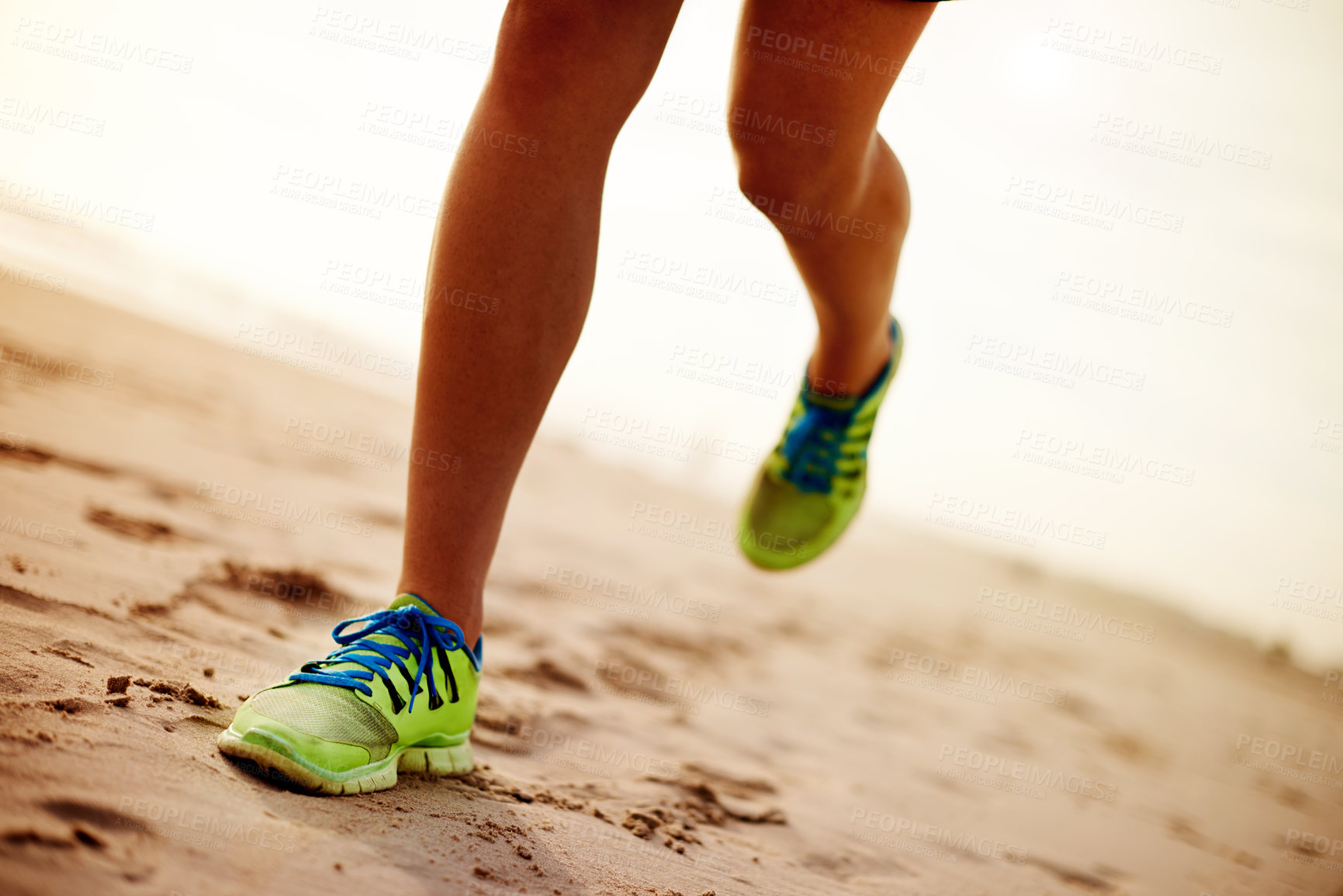 Buy stock photo Person, sand and feet running on beach for fitness, outdoor cardio and sports workout for exercise. Island, sneakers and athlete for training in nature, ocean and performance on tropical holiday
