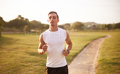 Buy stock photo Nature, running and man with fitness on trail for workout, marathon training or endurance challenge. Sports, wellness and athlete person in park for morning cardio, performance or race in Cardiff