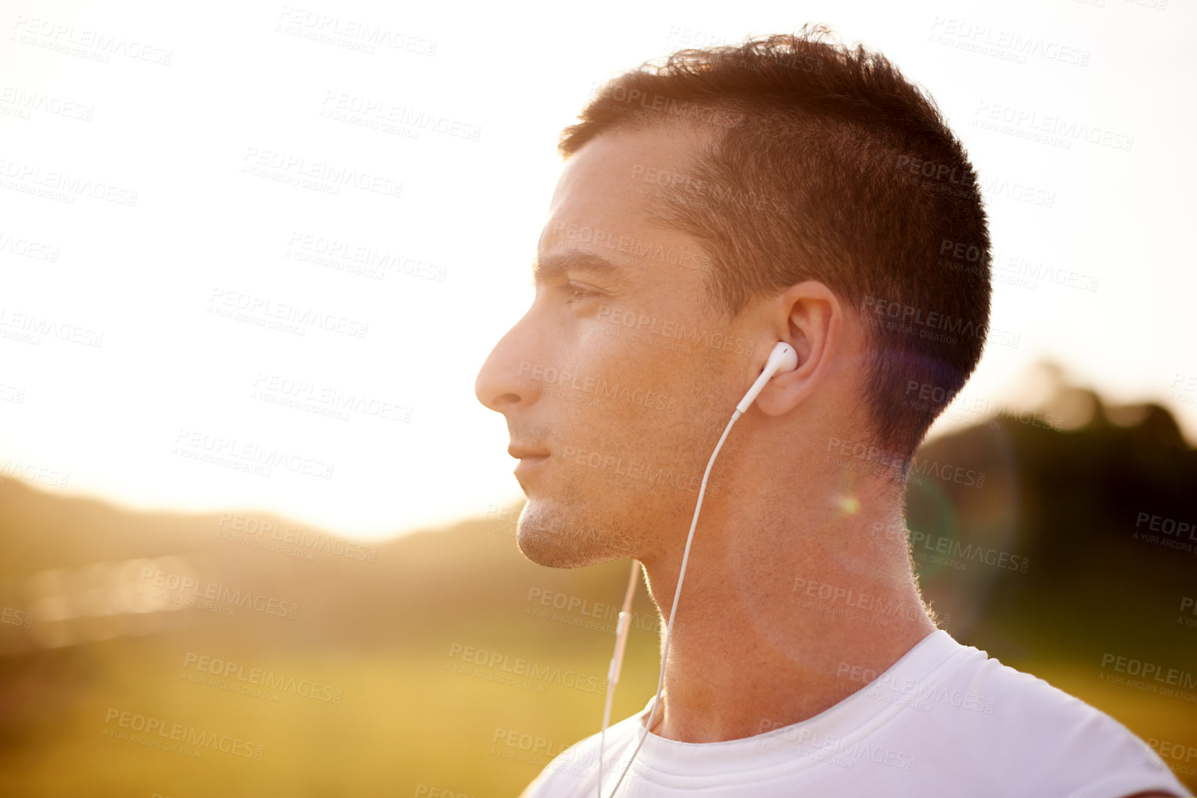 Buy stock photo Fitness, thinking and man with earphones outdoor for running with music, album or playlist for challenge. Sports, workout and athlete runner with audio tech for race, marathon or endurance training.